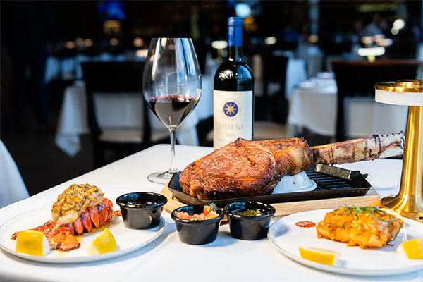 Tomahawk Steak and Lobster Tail | Photo: M Grill